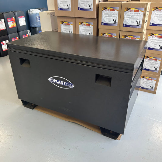 Black storage box with 'KDPlant.com' logo on a warehouse floor with boxes and containers in the background.